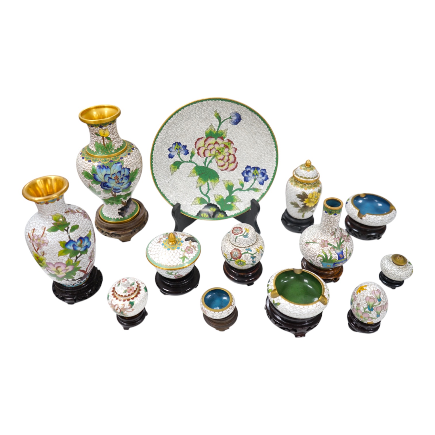 A collection of Chinese cloisonné enamel vases, pots etc., all worked on a white background in floral designs, plate, 20cm diameter. Condition - good